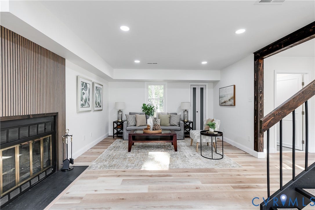 High ceilings and natural light give this living area an open, inviting feel
