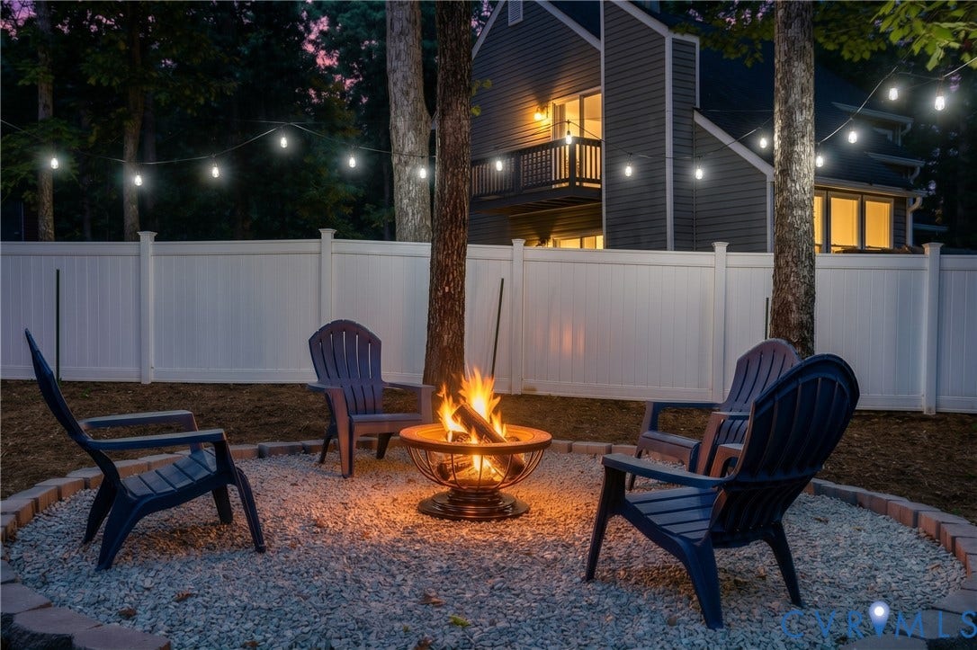 Outdoor string lights set the mood for relaxing evenings around the fire