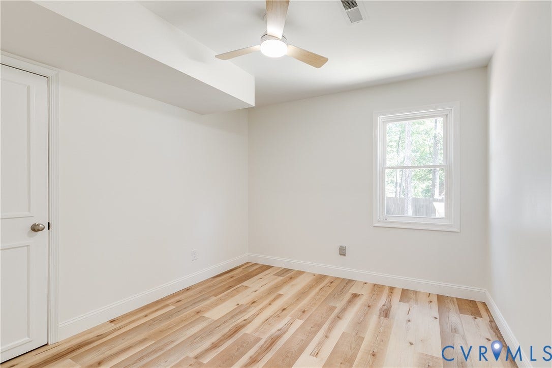 Flexible main-level bedroom space ready to serve as a guest room, office, or personal retreat