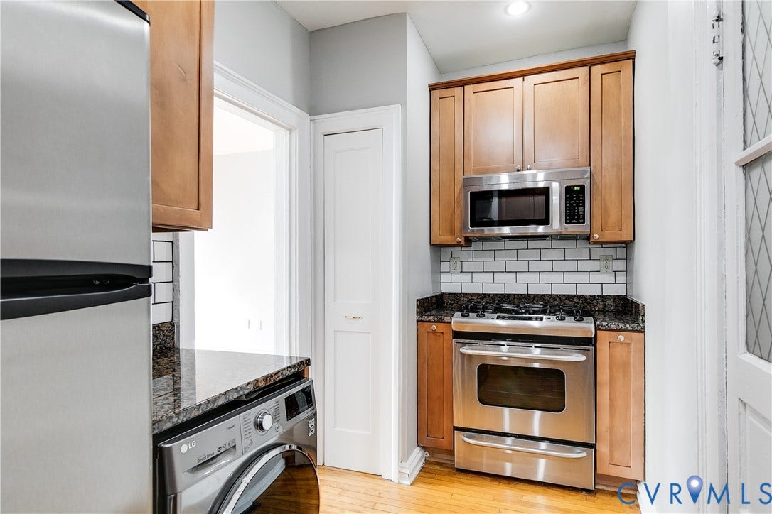 Armoire included to expand closet space.