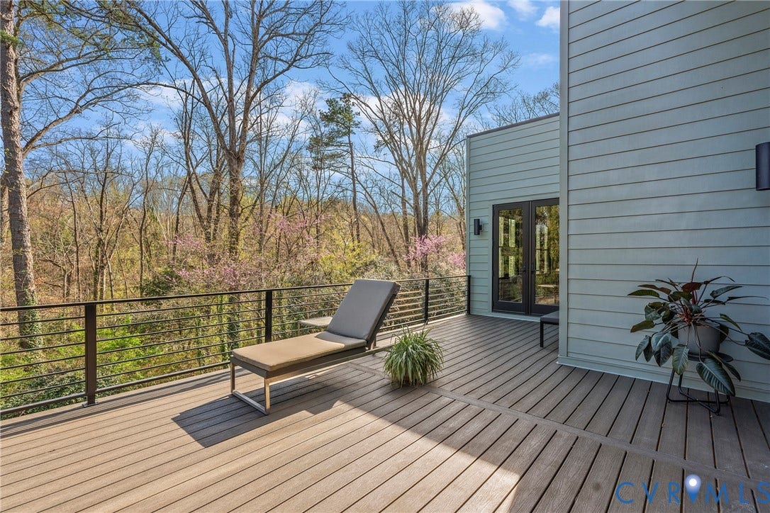 7301 Riverside Drive, Richmond, VA 23225 Spacious outdoor deck featuring composite decking, contemporary cable railing, and direct access to the interior through a black-framed double door