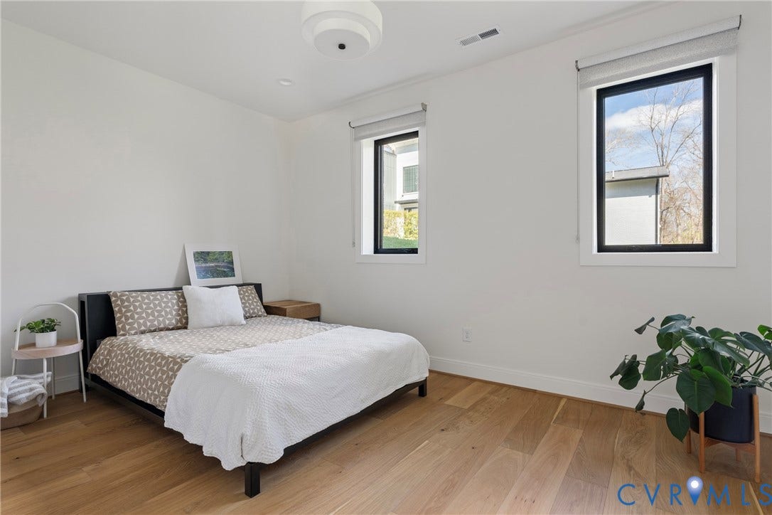 7301 Riverside Drive, Richmond, VA 23225 Bright room with two vertical windows featuring black frames