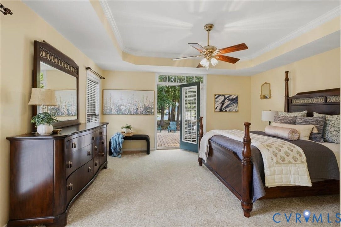 1824 Sidney Court, Glen Allen, VA 23059 1st Floor Primary Bedroom. French Doors open to back deck. Recessed ceiling with crown molding and a ceiling fan
