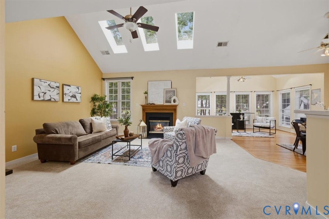 1824 Sidney Court, Glen Allen, VA 23059 Vaulted ceiling family room featuring NEW carpet, gas fireplace, multiple skylights, and a ceiling fan