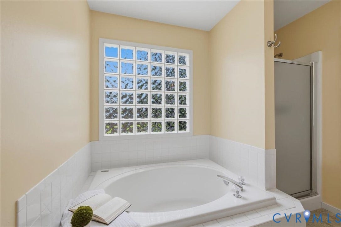 1824 Sidney Court, Glen Allen, VA 23059 Soaking tub with white tile surround and a glass block window, separate shower