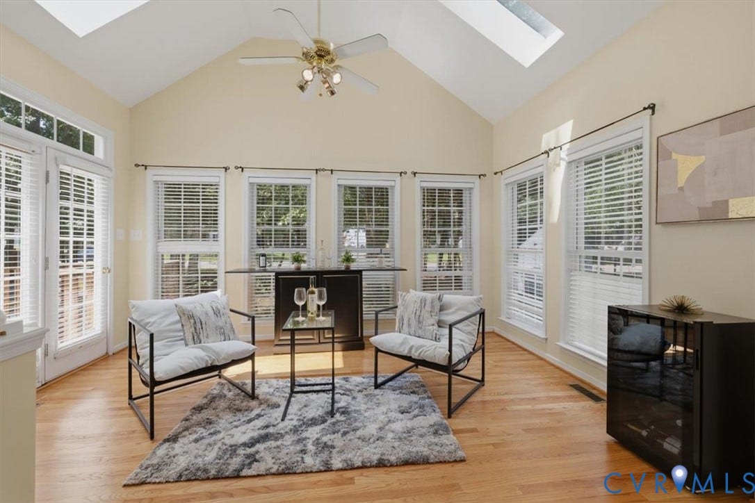 1824 Sidney Court, Glen Allen, VA 23059 Bright sunroom featuring a vaulted ceiling with skylights, double French doors, wood-finish flooring, a ceiling fan, and multiple windows with blinds