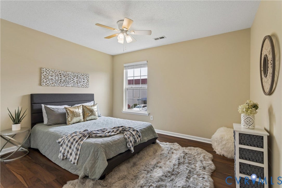 21 St Johns Drive, Hampton, VA 23666 Bedroom featuring wood-finish flooring, a double window with blinds, a ceiling fan with integrated lighting, and neutral wall tones