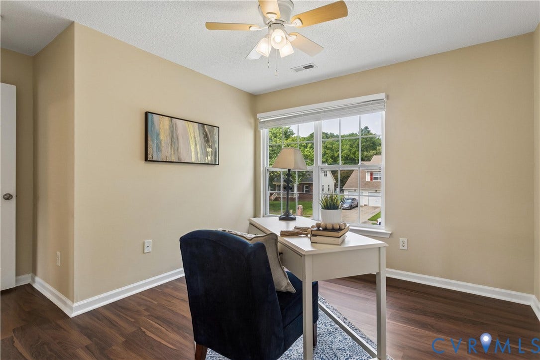 21 St Johns Drive, Hampton, VA 23666 Room featuring wood-finish flooring, a ceiling fan with integrated lighting, and a large window with white blinds