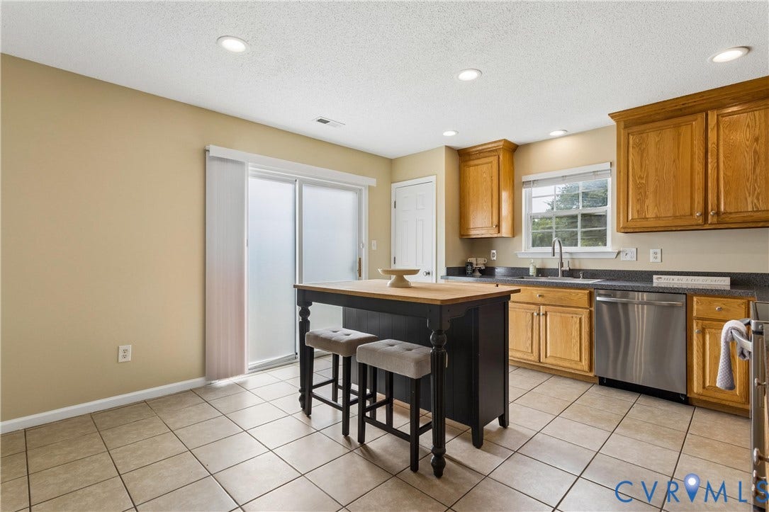 21 St Johns Drive, Hampton, VA 23666 Kitchen featuring a central island with a wood-finish countertop, tile flooring, wood cabinetry, stainless steel dishwasher, and recessed lighting