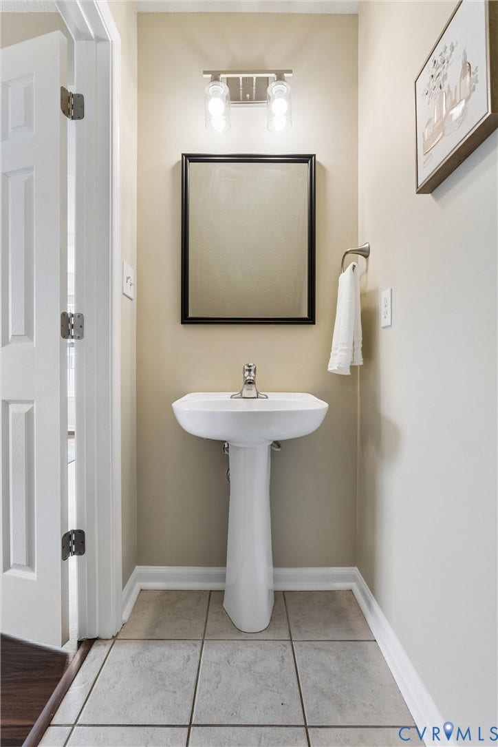 21 St Johns Drive, Hampton, VA 23666 Pedestal sink with chrome faucet and square framed mirror