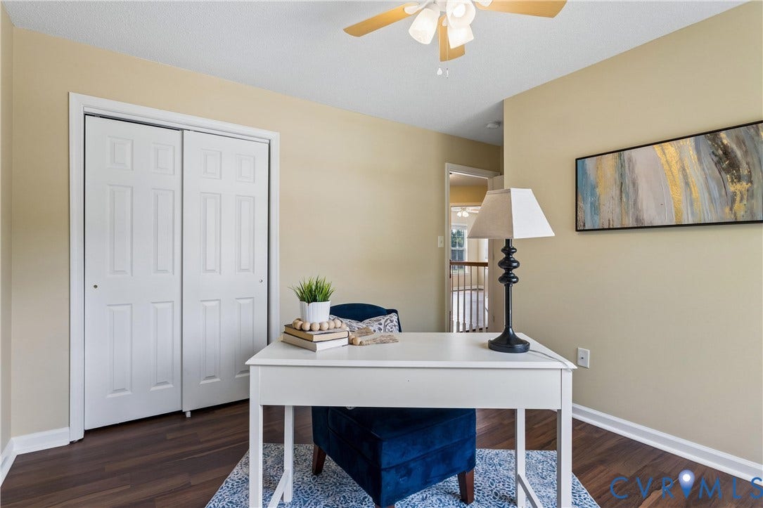 21 St Johns Drive, Hampton, VA 23666 Room featuring wood-finish flooring, a ceiling fan with integrated lighting, and a white bi-fold closet