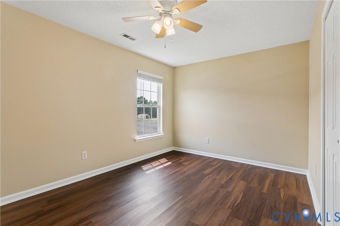 21 St Johns Drive, Hampton, VA 23666 Room featuring wood-finish flooring, neutral wall paint, and white trim