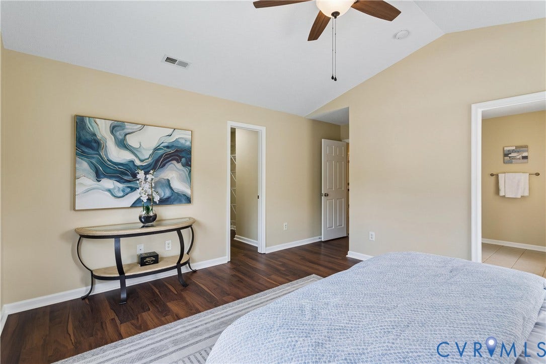 21 St Johns Drive, Hampton, VA 23666 Room featuring wood-finish flooring, vaulted ceiling, and a ceiling fan with integrated lighting