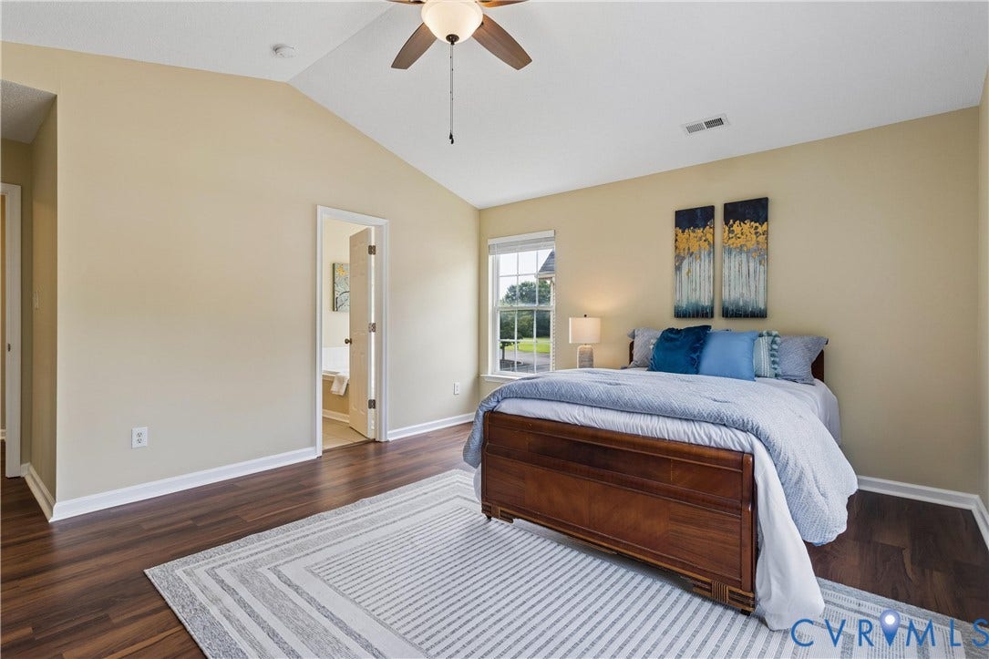 21 St Johns Drive, Hampton, VA 23666 Vaulted ceiling bedroom featuring wood-finish flooring and a ceiling fan