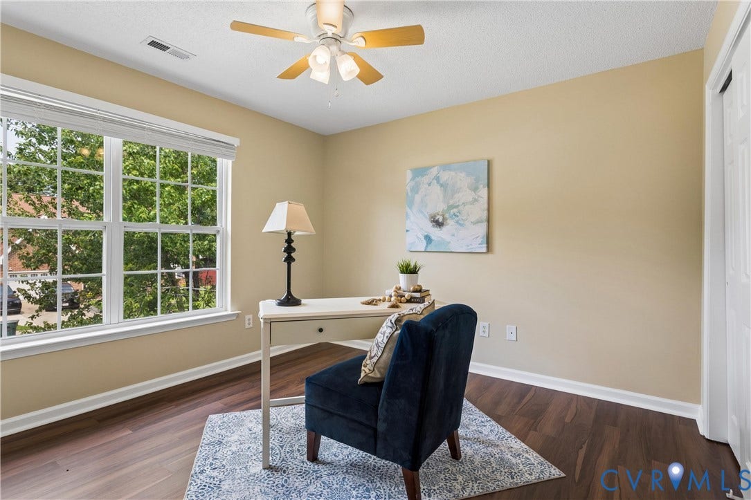 21 St Johns Drive, Hampton, VA 23666 Room featuring wood-finish flooring, a multi-pane window with blinds, and a ceiling fan with light fixture