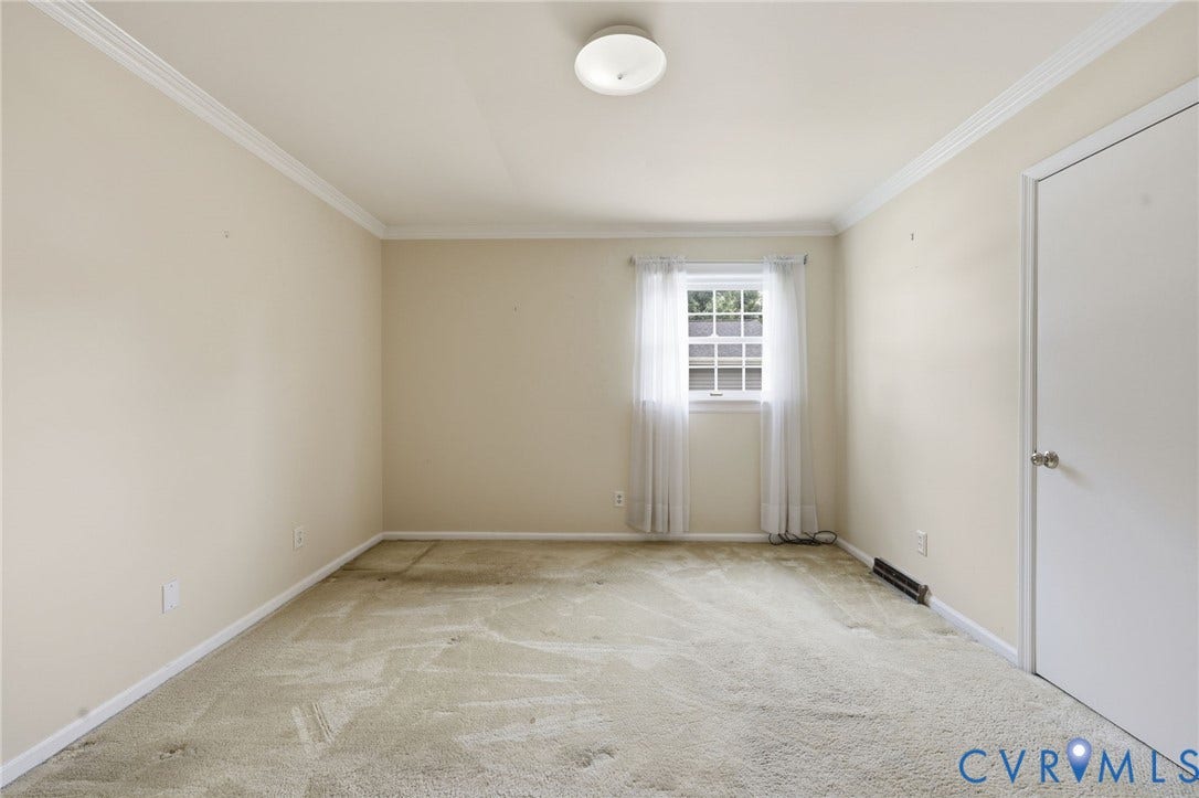 121 Huntington Road, Colonial Heights, VA 23834 Neutral-toned walls with white crown molding and baseboards