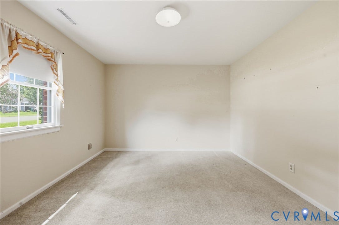 121 Huntington Road, Colonial Heights, VA 23834 Neutral-toned room with light beige carpet and white baseboards