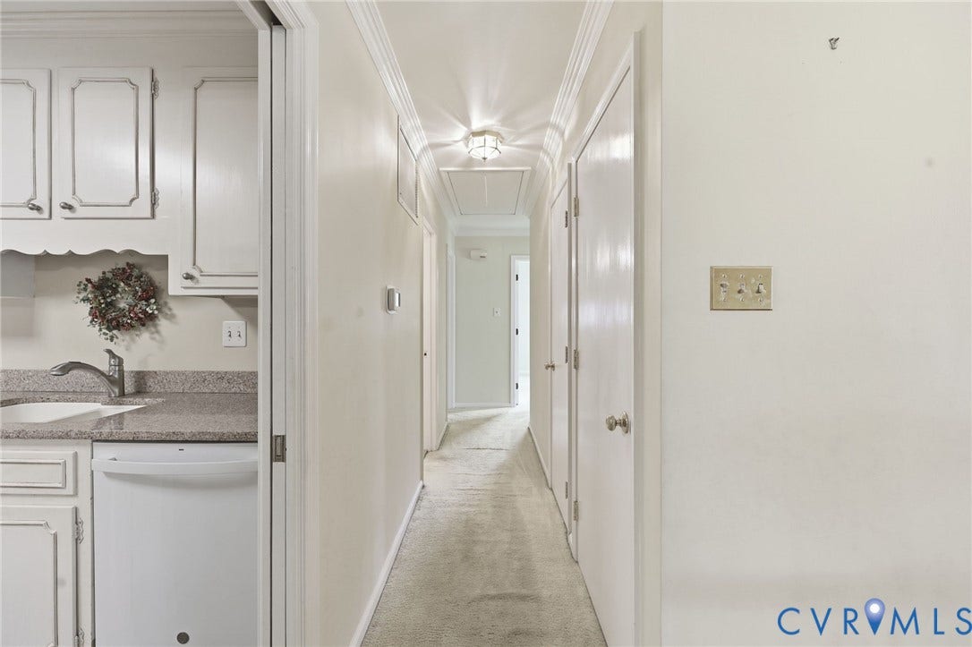 121 Huntington Road, Colonial Heights, VA 23834 Well-lit hallway with carpet flooring featuring a flush-mount ceiling light and crown molding