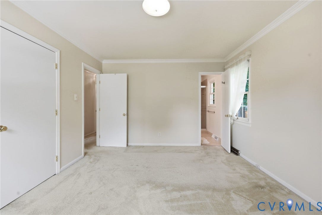 121 Huntington Road, Colonial Heights, VA 23834 Spacious room featuring neutral wall tones, crown molding, and carpeted flooring