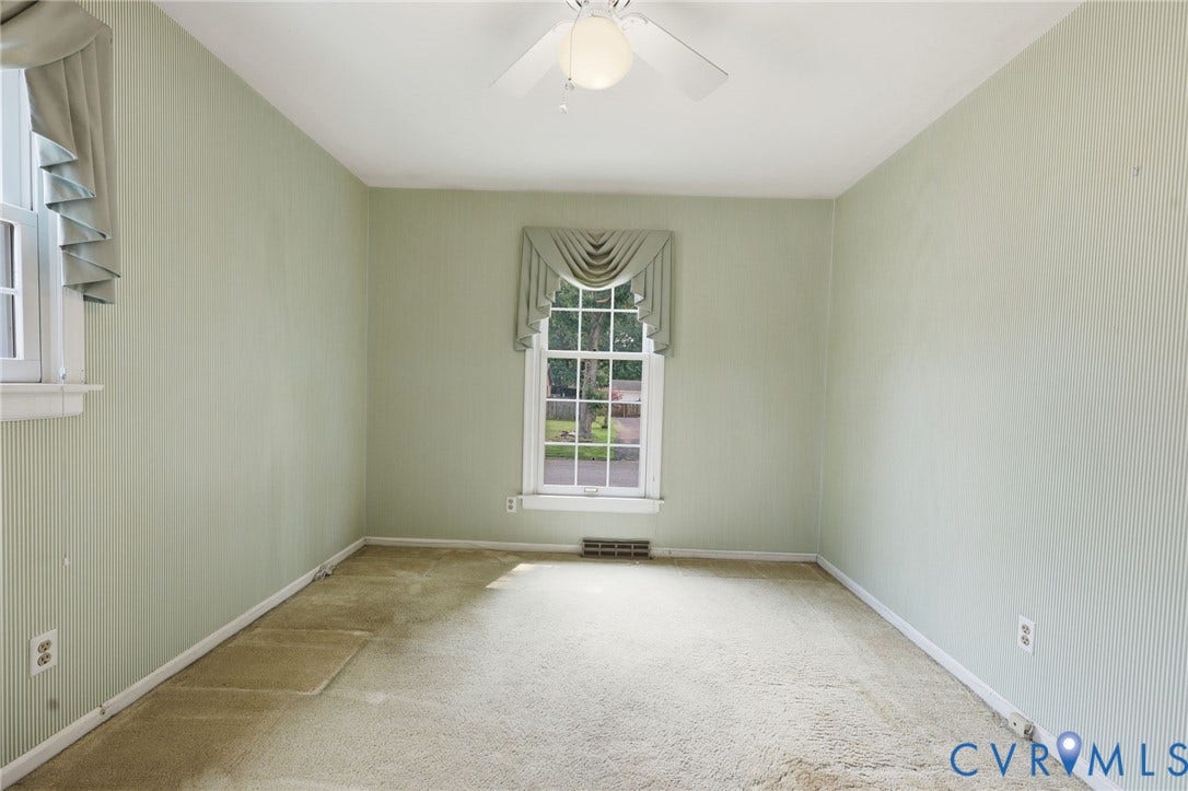 121 Huntington Road, Colonial Heights, VA 23834 Room featuring light green textured wallpaper, white trim, and a ceiling fan with integrated lighting