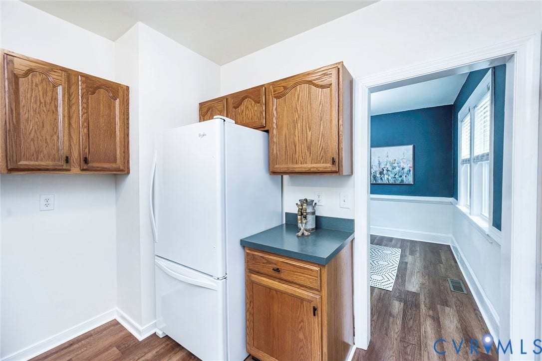 1402 Rhode Island Avenue, Glen Allen, VA 23060 Kitchenette featuring wood-finish cabinetry, solid surface countertop, and wood-finish flooring