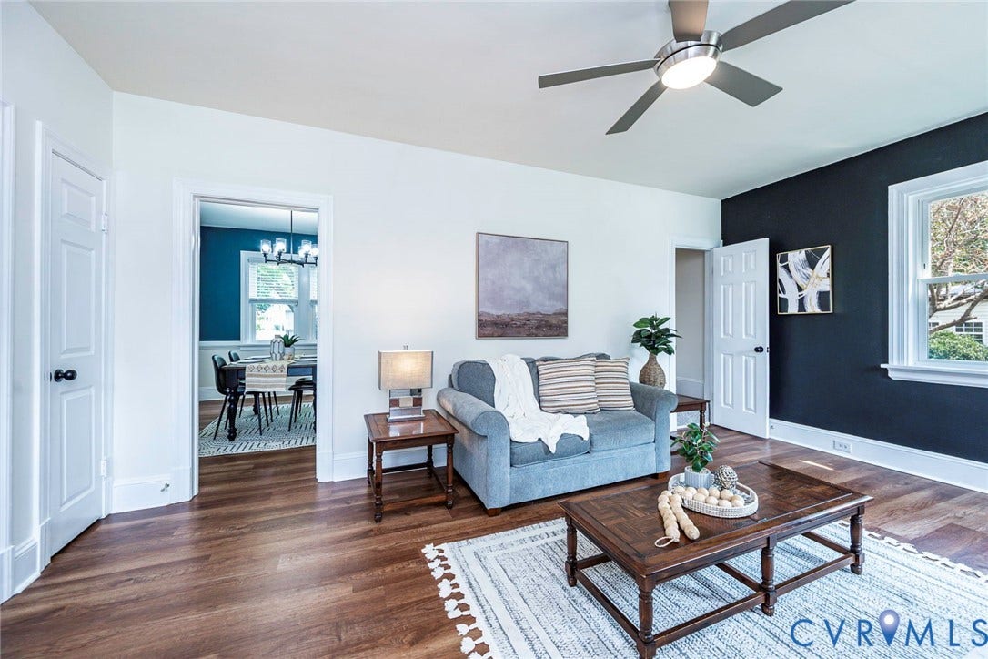 1402 Rhode Island Avenue, Glen Allen, VA 23060 Living area featuring wood-finish flooring, white walls with an accent wall, a ceiling fan, and a wide entryway