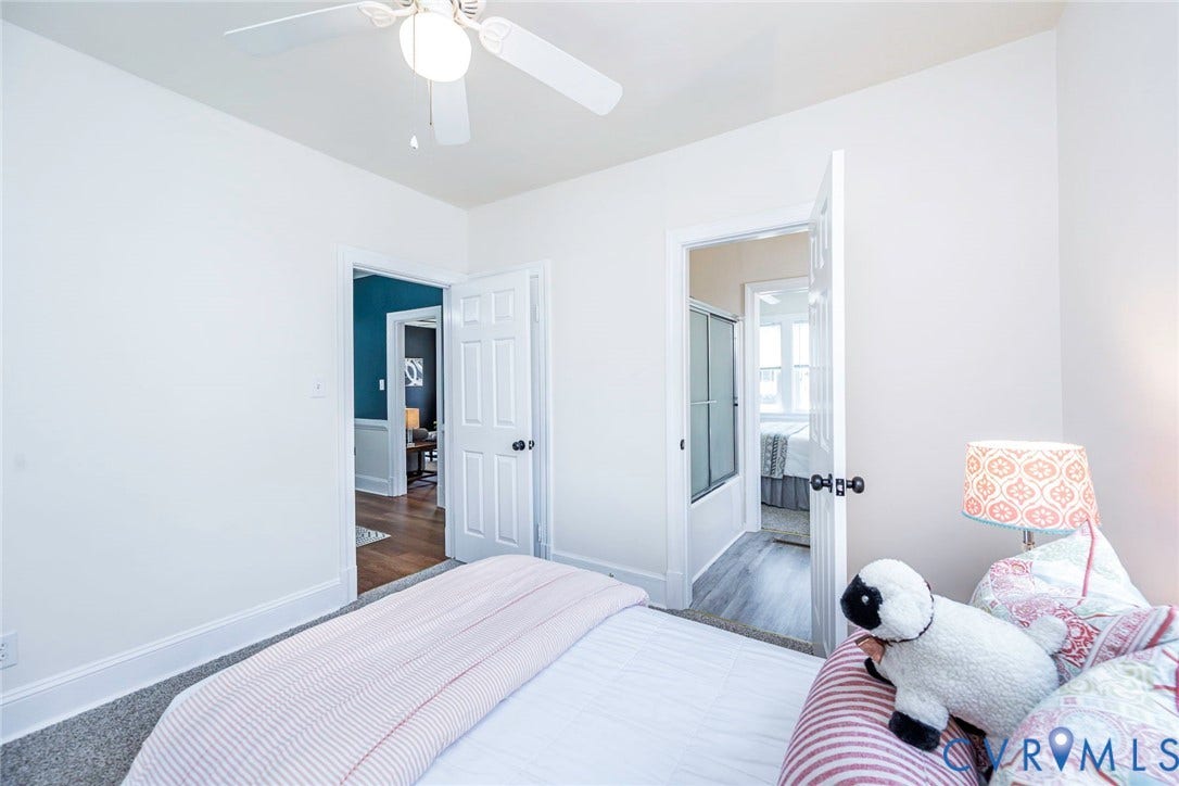 1402 Rhode Island Avenue, Glen Allen, VA 23060 Light-filled room featuring white walls, a ceiling fan with integrated lighting, and carpeted flooring