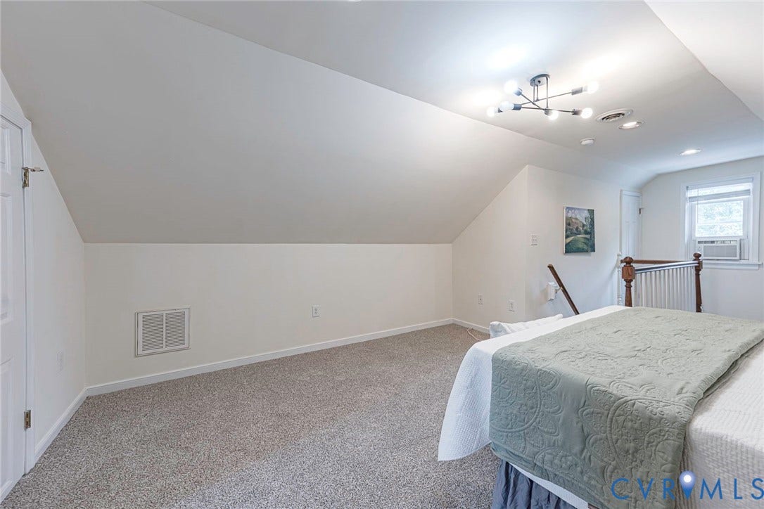 1402 Rhode Island Avenue, Glen Allen, VA 23060 Carpeted room featuring a sloped ceiling, modern chandelier, recessed lighting, and a window with an air conditioning unit