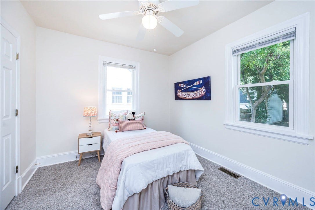 1402 Rhode Island Avenue, Glen Allen, VA 23060 Room featuring two windows with white trim, a ceiling fan, and grey carpet flooring