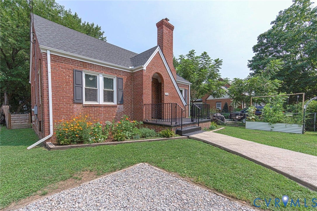 1402 Rhode Island Avenue, Glen Allen, VA 23060 Brick exterior featuring a gabled roof and arched entry