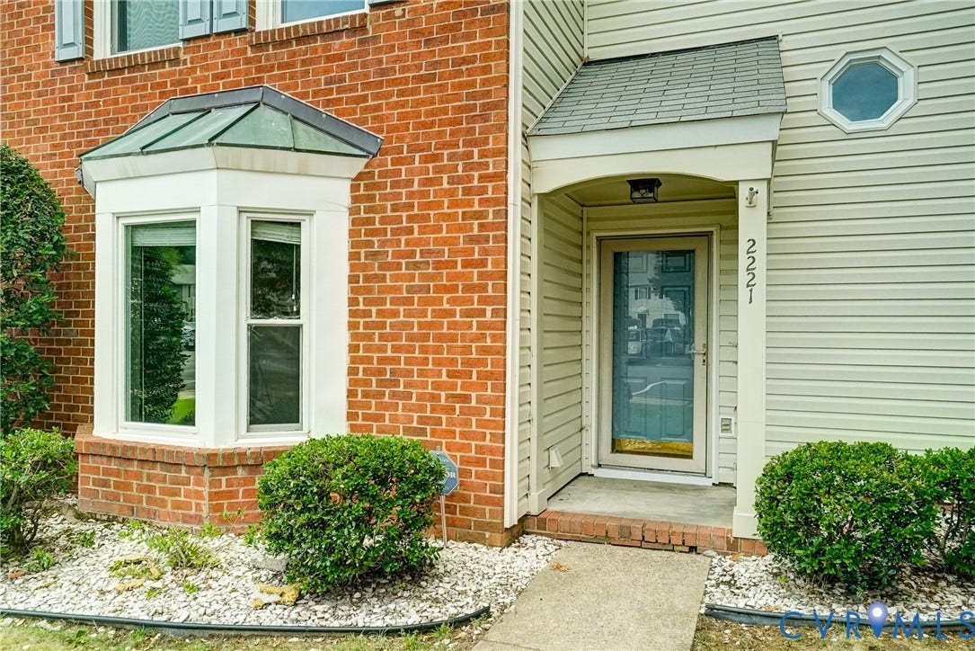 2221 High Bush Circle, Glen Allen, VA 23060 Brick and siding exterior featuring a covered entry porch