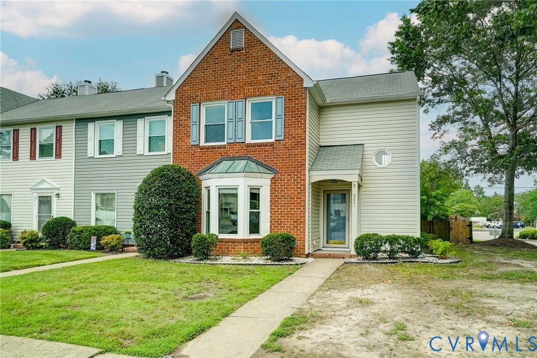2221 High Bush Circle, Glen Allen, VA 23060 Brick and siding exterior featuring a bay window, a covered entry, and a symmetrical front facade