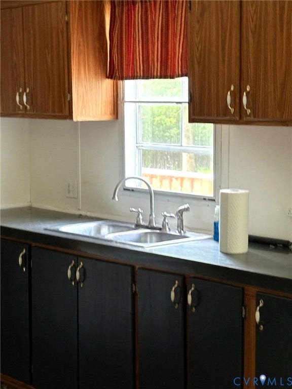 Dual basin stainless steel sink with a chrome faucet
