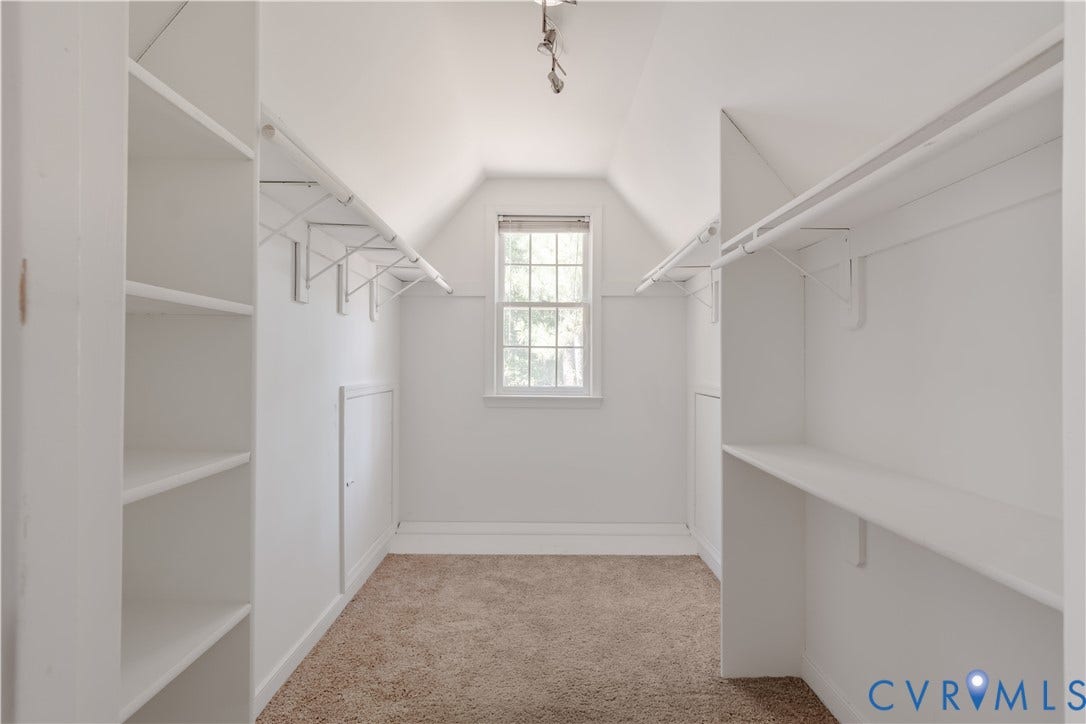 Huge walk in closet with additional dormer storage in primary bedroom