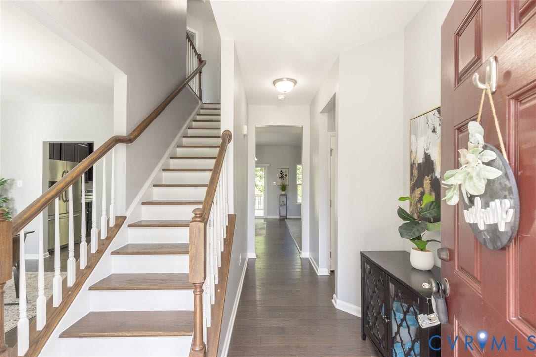 12814 Bailey Hill Court, Bayhill Pointe, Midlothian, VA 23112 Hardwood flooring, painted walls, open-tread staircase with wood handrails, recessed lighting, and a solid panel entry door
