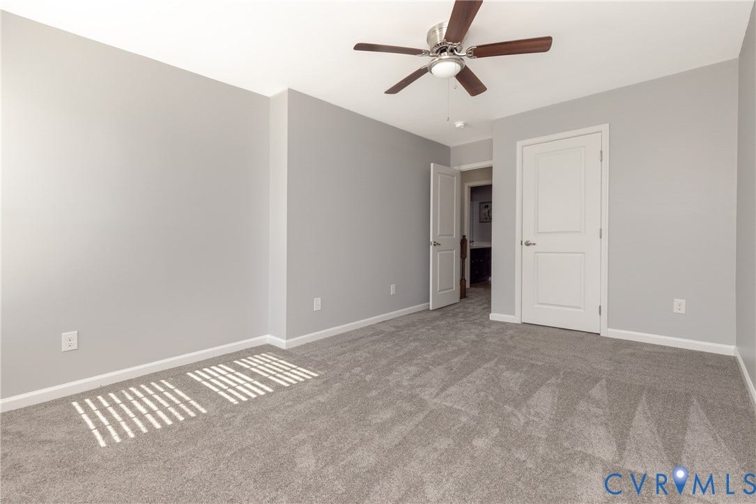 12814 Bailey Hill Court, Bayhill Pointe, Midlothian, VA 23112 Neutral gray walls with white trim, gray textured carpet, and a ceiling fan with brushed nickel accents