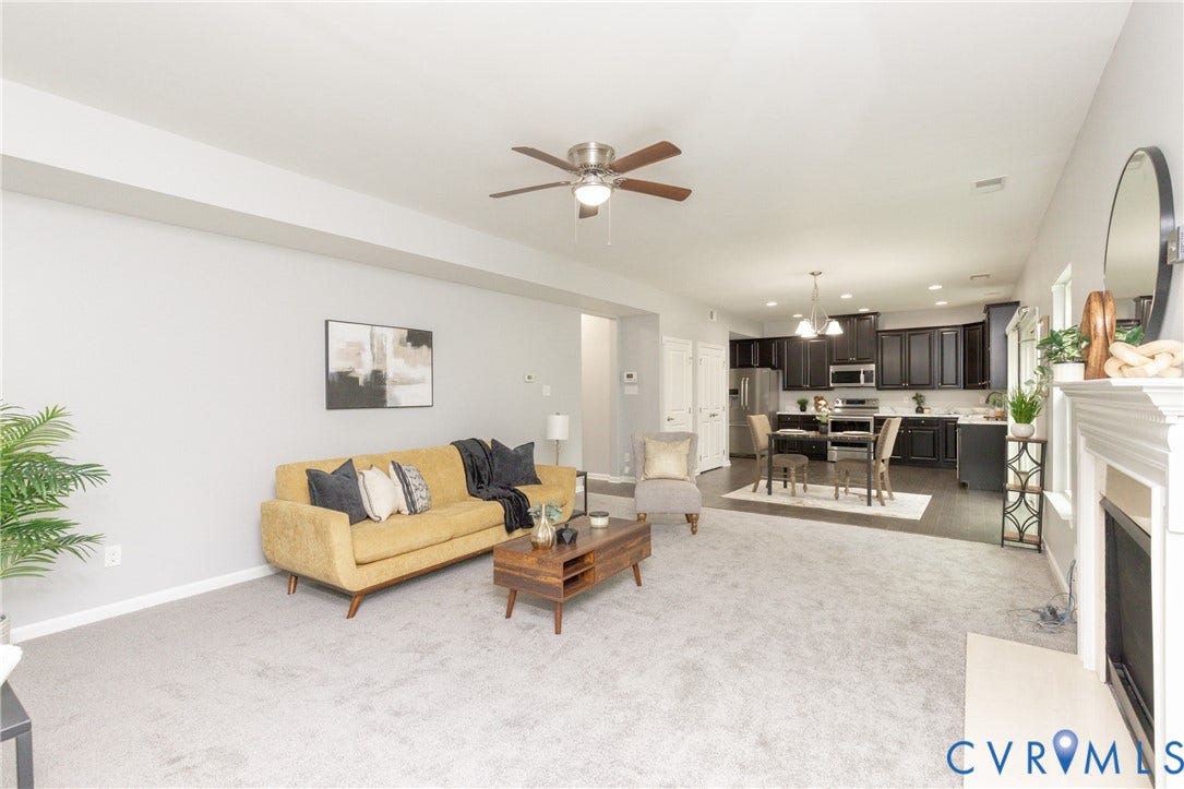 12814 Bailey Hill Court, Bayhill Pointe, Midlothian, VA 23112 Spacious living area with light gray carpeting and a ceiling fan, featuring an open concept design