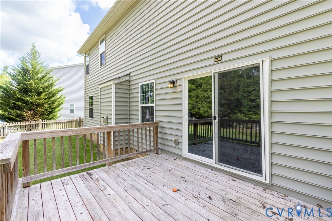 12814 Bailey Hill Court, Bayhill Pointe, Midlothian, VA 23112 Wood deck with a sliding glass door and exterior wall sconce