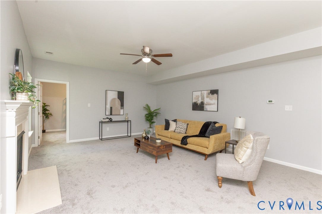 12814 Bailey Hill Court, Bayhill Pointe, Midlothian, VA 23112 Living area featuring a fireplace with a mantel, light gray carpeting, and a ceiling fan