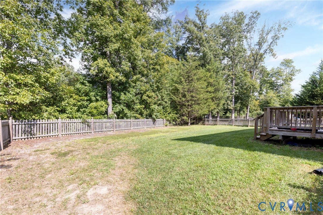 12814 Bailey Hill Court, Bayhill Pointe, Midlothian, VA 23112 Expansive backyard featuring a wood deck, wood picket fencing, and mature trees