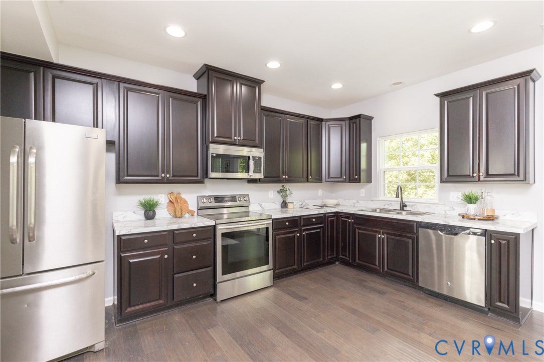12814 Bailey Hill Court, Bayhill Pointe, Midlothian, VA 23112 Kitchen featuring dark wood cabinetry, white countertops, stainless steel appliances, and wood-finish flooring