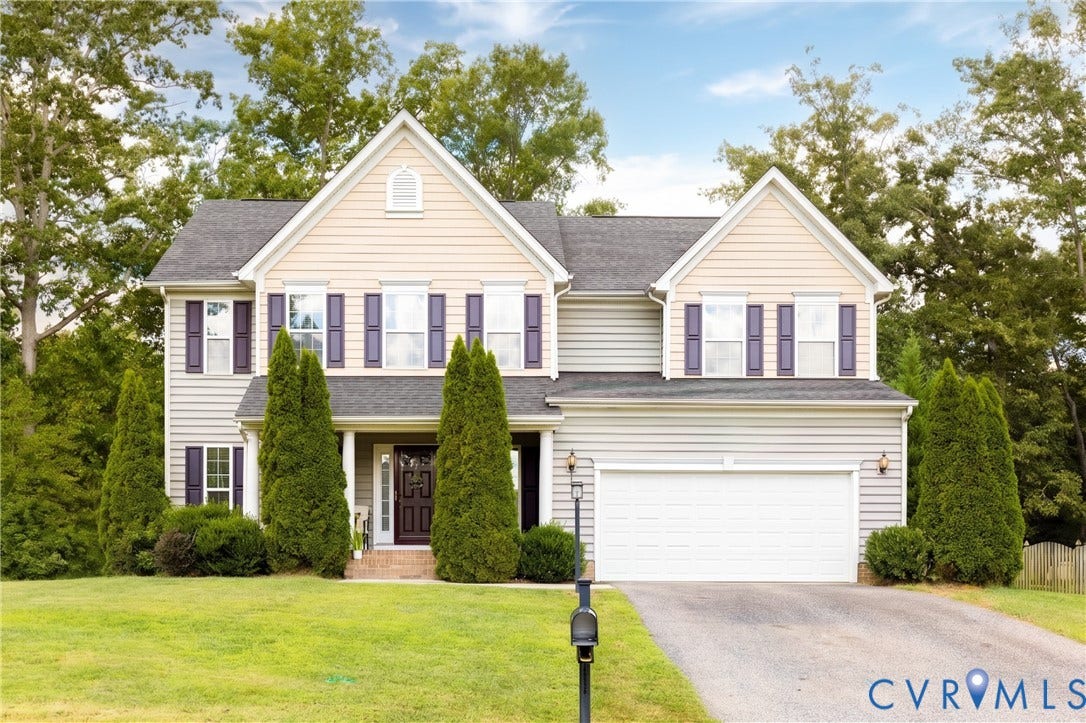 12814 Bailey Hill Court, Bayhill Pointe, Midlothian, VA 23112 Two-story residence featuring light-colored siding, a dark asphalt shingle roof, dark shutters, and an attached two-car garage