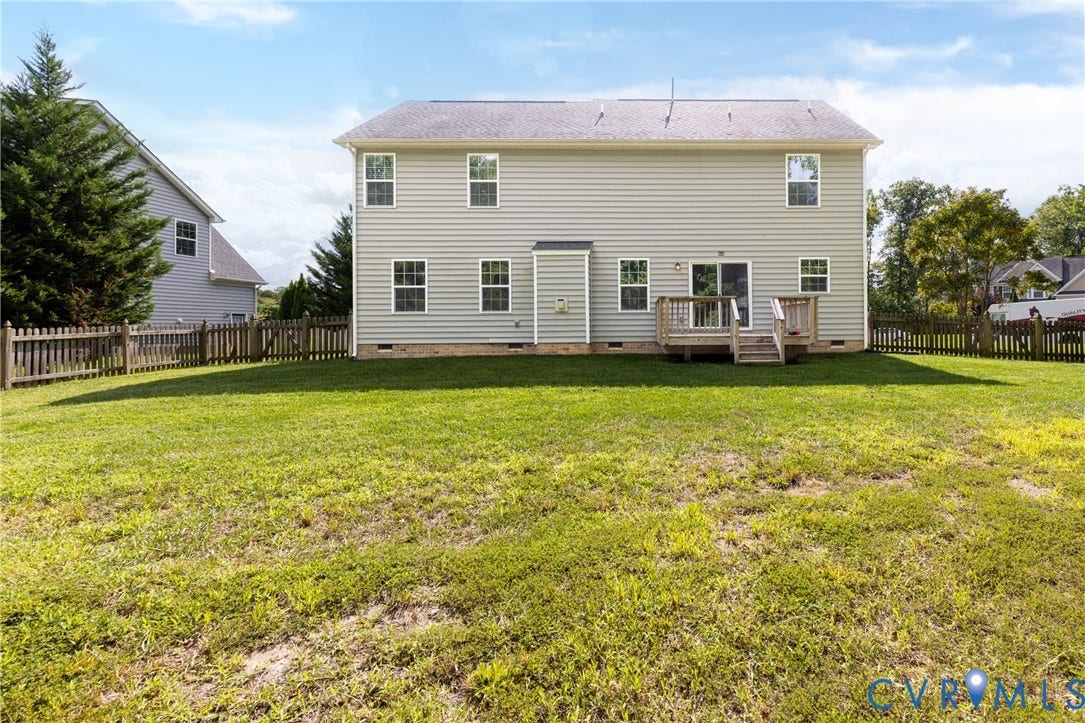 12814 Bailey Hill Court, Bayhill Pointe, Midlothian, VA 23112 Expansive lawn area with a wood picket fence, multi-level wood deck, and light-colored vinyl siding