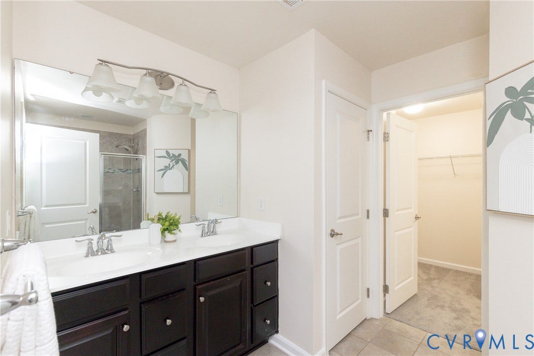 12814 Bailey Hill Court, Bayhill Pointe, Midlothian, VA 23112 Double vanity with white countertop, dark wood-finish cabinetry, and brushed nickel fixtures