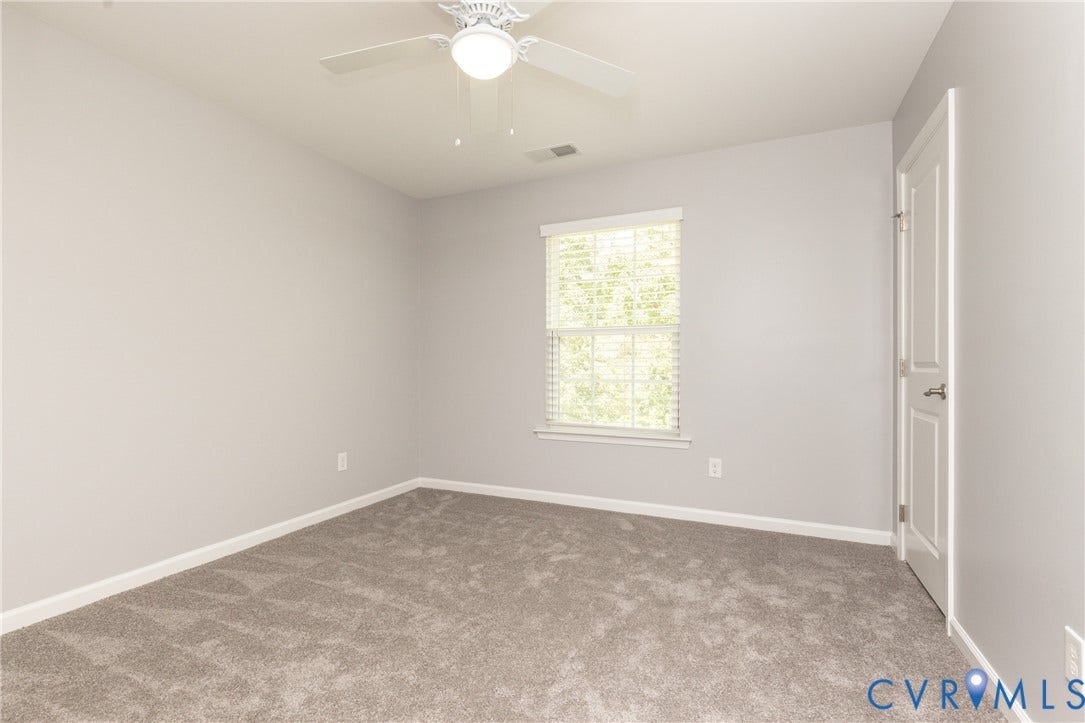12814 Bailey Hill Court, Bayhill Pointe, Midlothian, VA 23112 Light gray carpeted flooring, single window with blinds, ceiling fan with integrated lighting, paneled interior door, light gray wall finishes