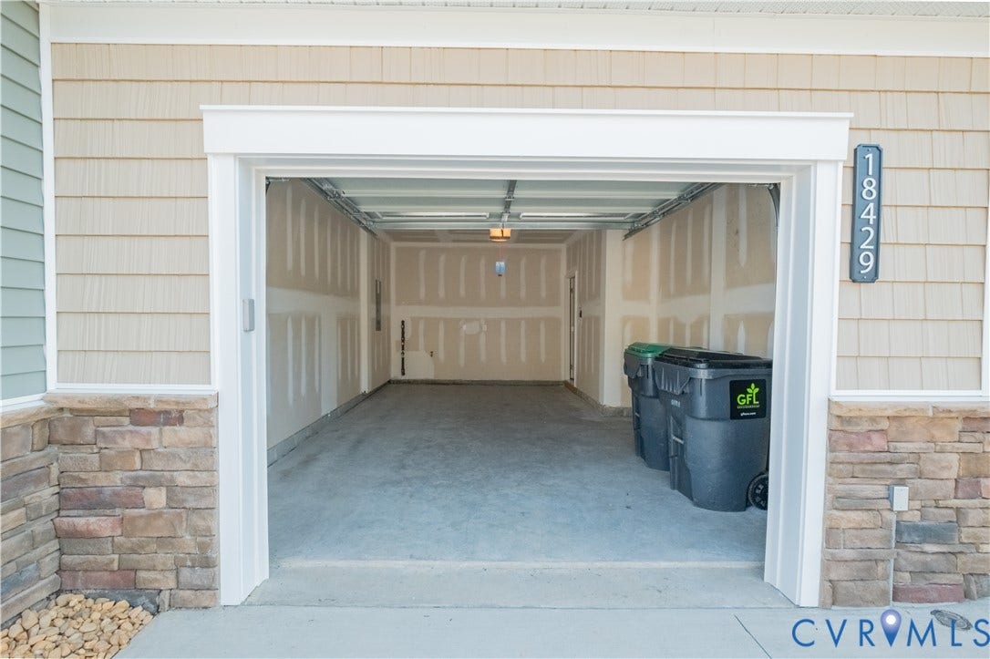 18429 Palisades Court, Chesterfield, VA 23120 Spacious garage with an exposed concrete floor and unfinished walls
