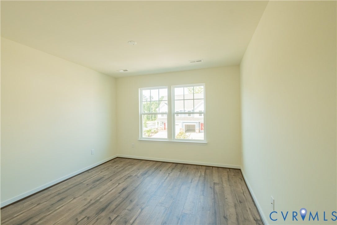 18429 Palisades Court, Chesterfield, VA 23120 Bright interior space featuring wood-finish flooring, neutral wall tones, and recessed ceiling lighting