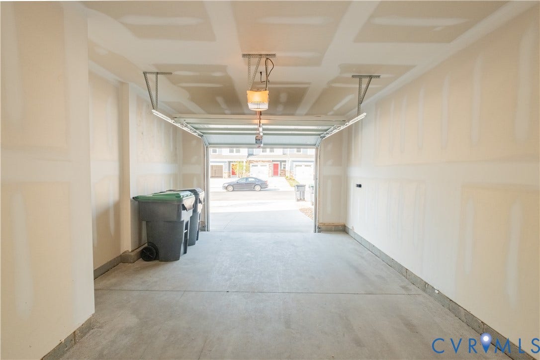 18429 Palisades Court, Chesterfield, VA 23120 Attached garage with concrete flooring, unfinished drywall, and an overhead garage door opener