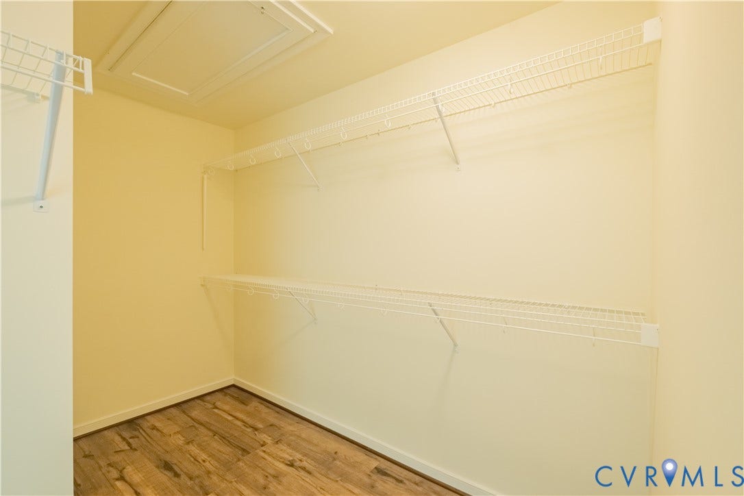 18429 Palisades Court, Chesterfield, VA 23120 Interior closet space featuring wire shelving systems, wood-finish flooring, and light-toned wall paint
