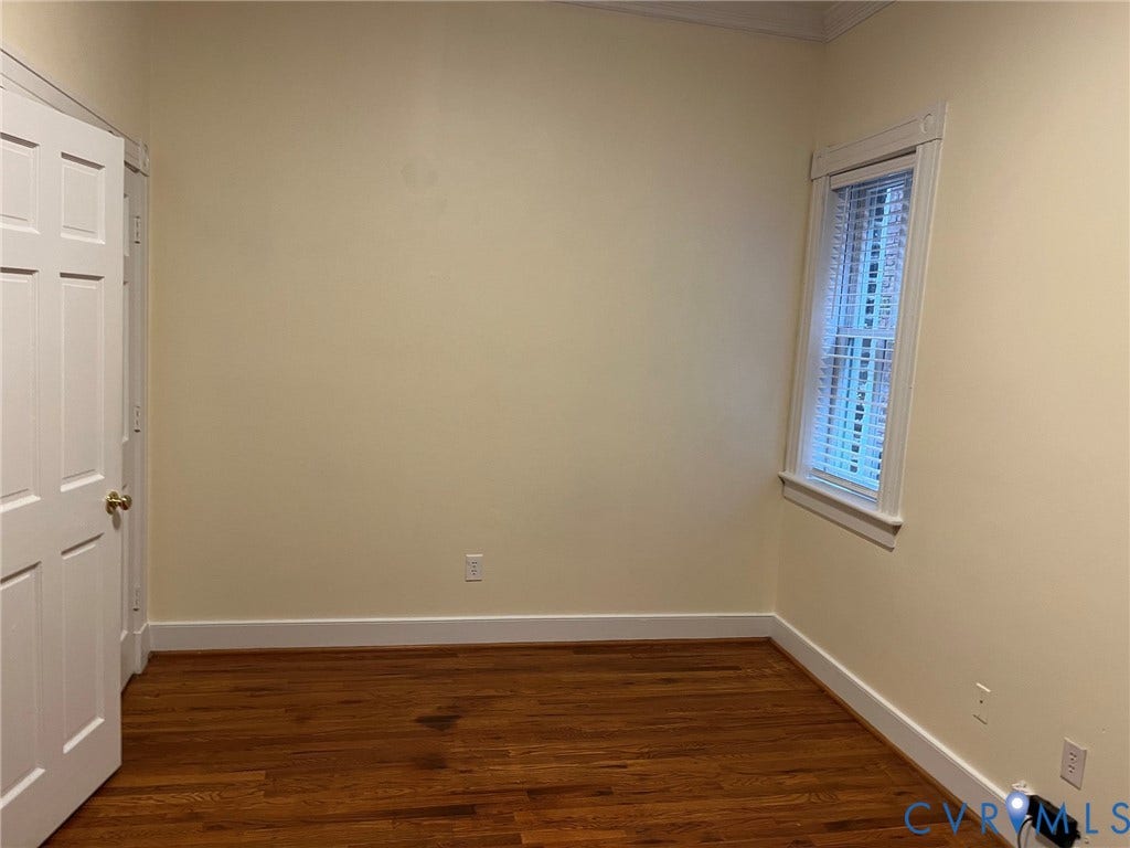 222 W Marshall Street, Jackson Ward, Richmond, VA 23220 Hardwood-finish flooring featuring a window with white blinds